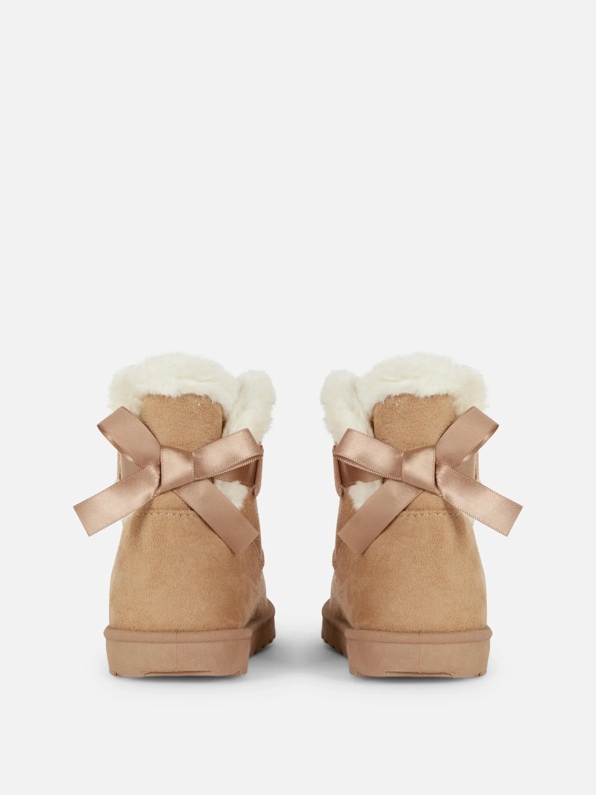 bottines_en_fausse_fourru_2.webp Bottines En Fausse Fourrure Avec Nœud