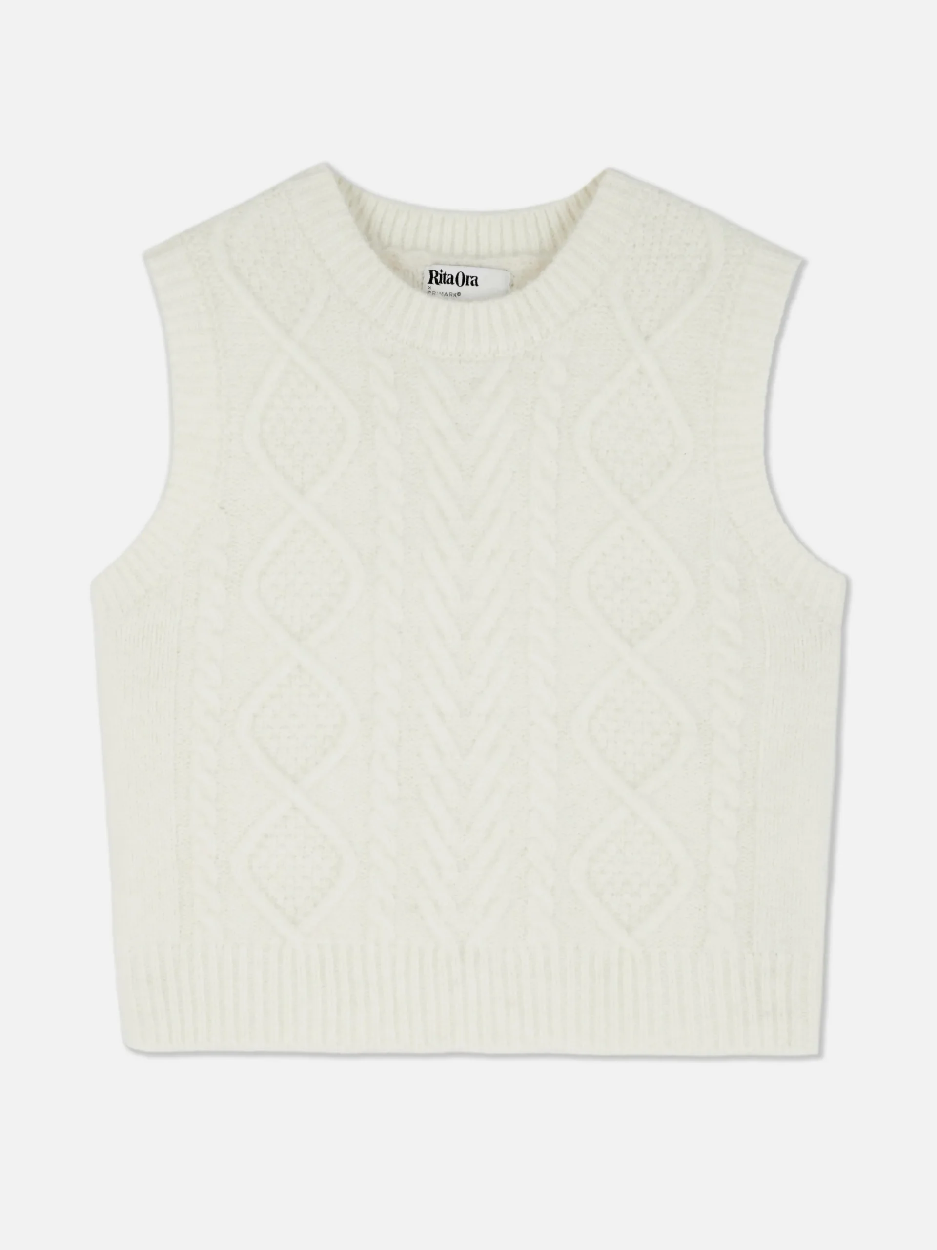 dbardeur_en_maille_torsad_4-1.webp Débardeur En Maille Torsadée Rita Ora