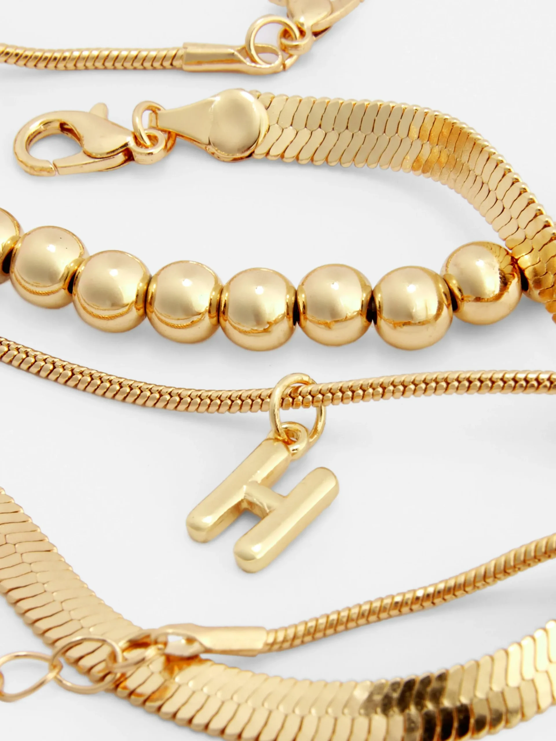 lot_de__chanes_de_chevill_1.webp Lot De 3 Chaînes De Cheville Infinité Et Initiale