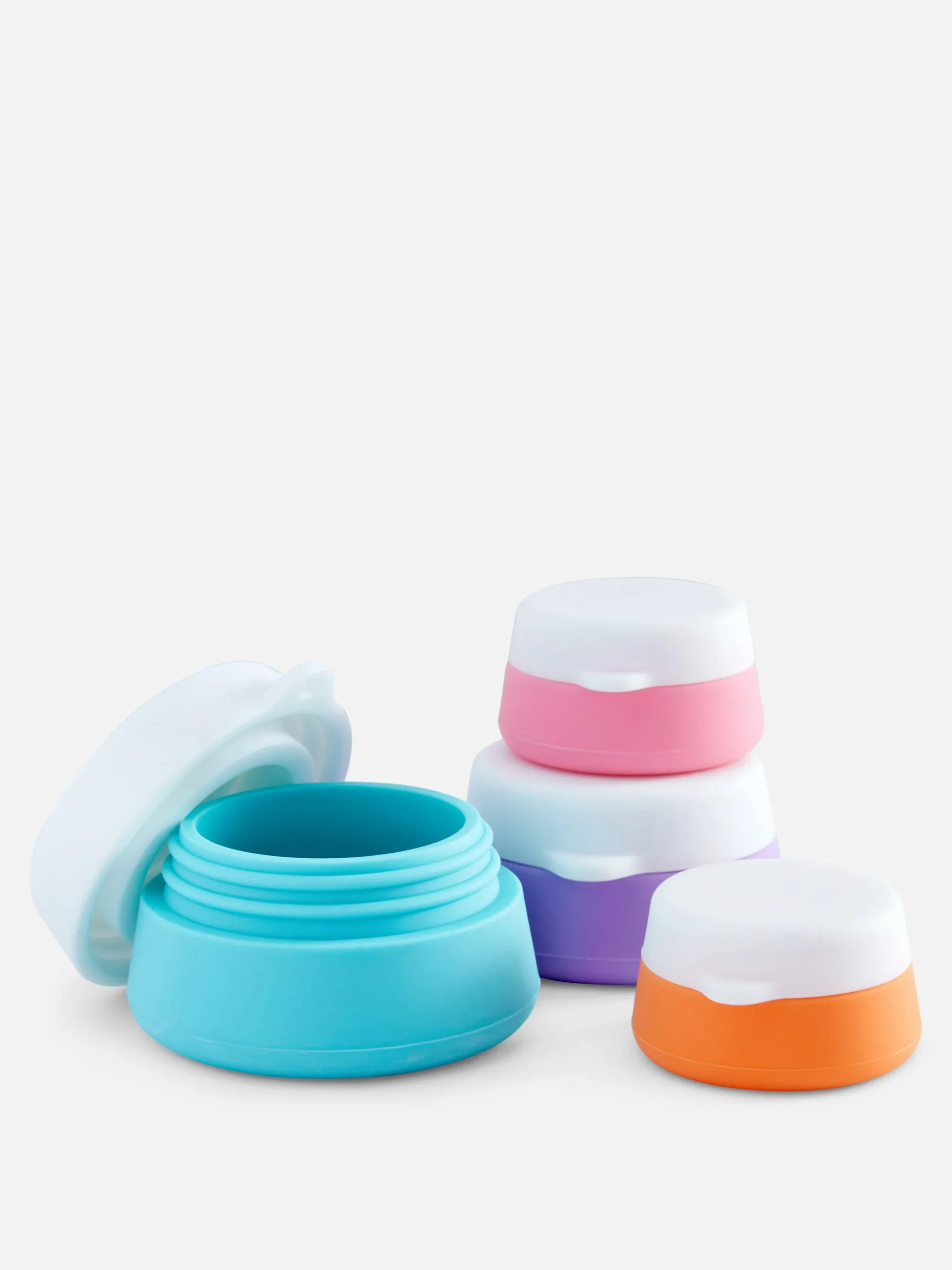 lot_de__pots_de_voyage_en_0.webp Lot De 4 Pots De Voyage En Silicone
