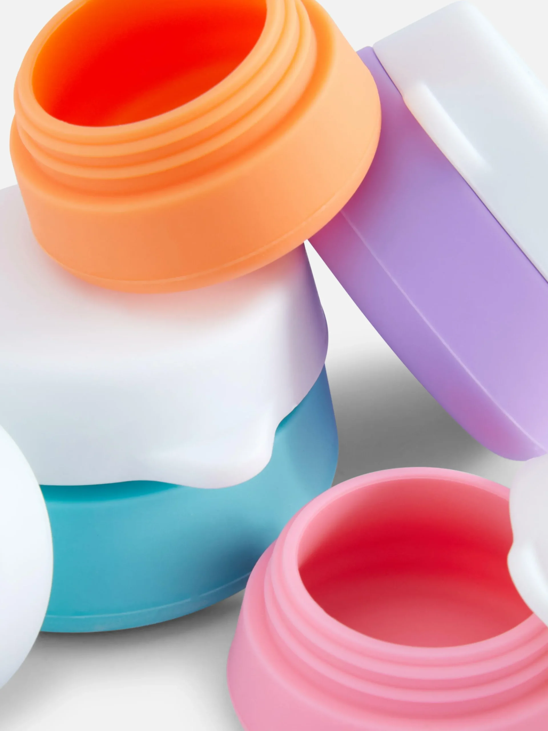 lot_de__pots_de_voyage_en_1.webp Lot De 4 Pots De Voyage En Silicone