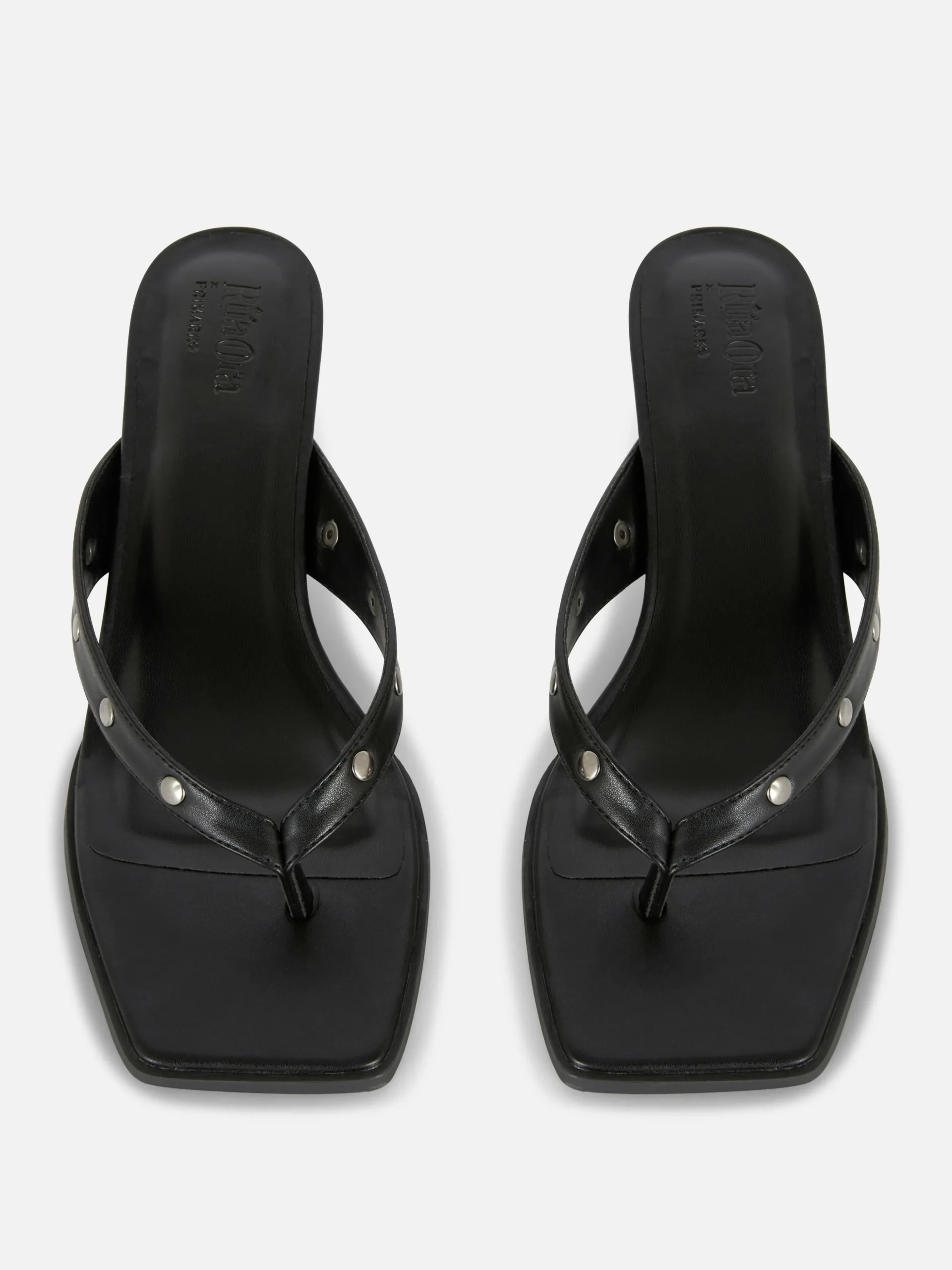 mules_cloutes_en_simili_c_1.webp Mules Cloutées En Simili Cuir Rita Ora