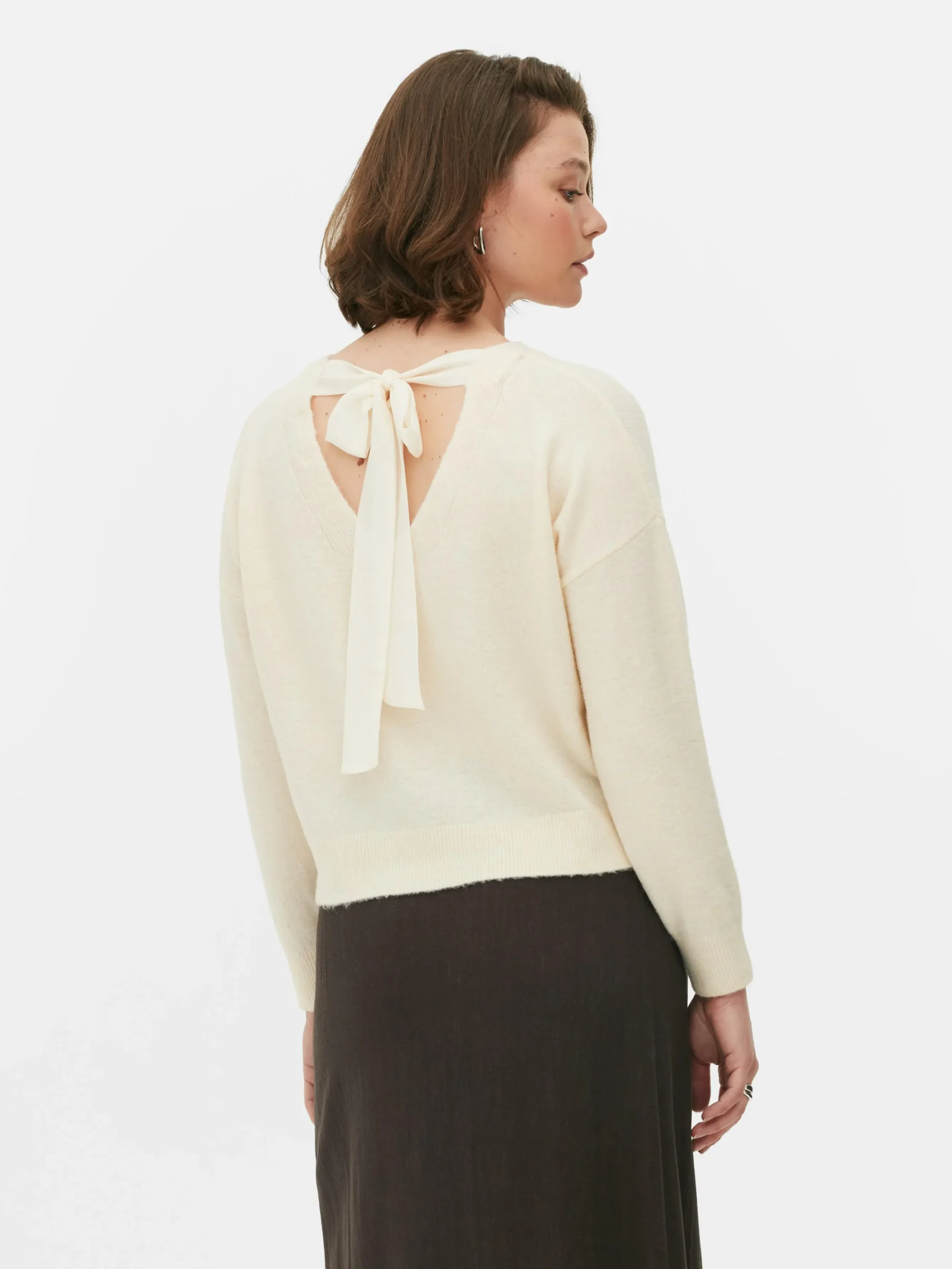 pull_tricot_avec_nud_dans_3-1.webp Pull Tricoté Avec Nœud Dans Le Dos